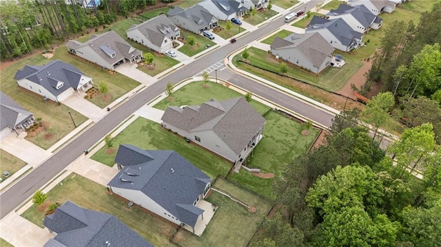 aerial view of property and surrounding area with nearby suburban area