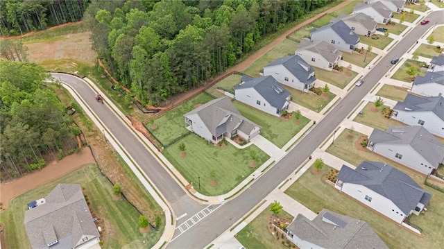 aerial view of property's location with nearby suburban area