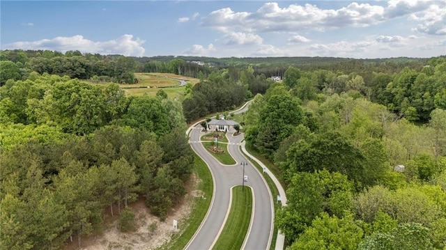 view of property location featuring a forest
