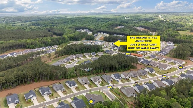 aerial overview of property's location with a heavily wooded area and nearby suburban area