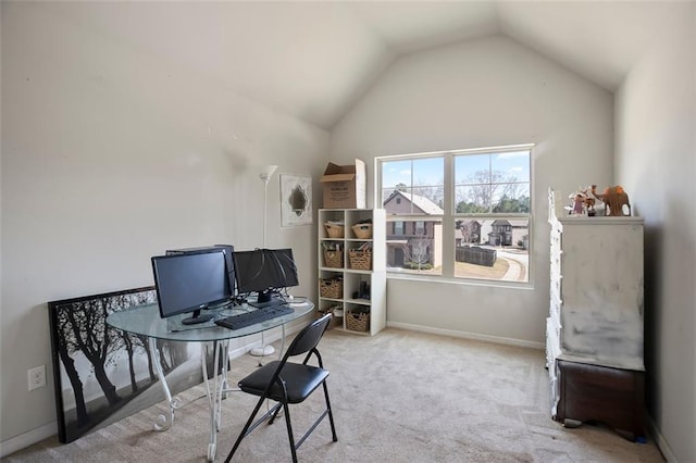 home office with carpet, baseboards, and vaulted ceiling