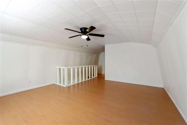 bonus room with hardwood / wood-style flooring, ceiling fan, and lofted ceiling