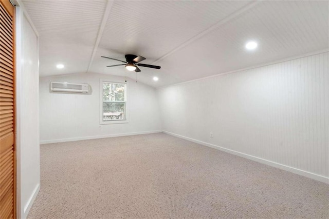 unfurnished room with carpet, ceiling fan, lofted ceiling, and a wall mounted AC