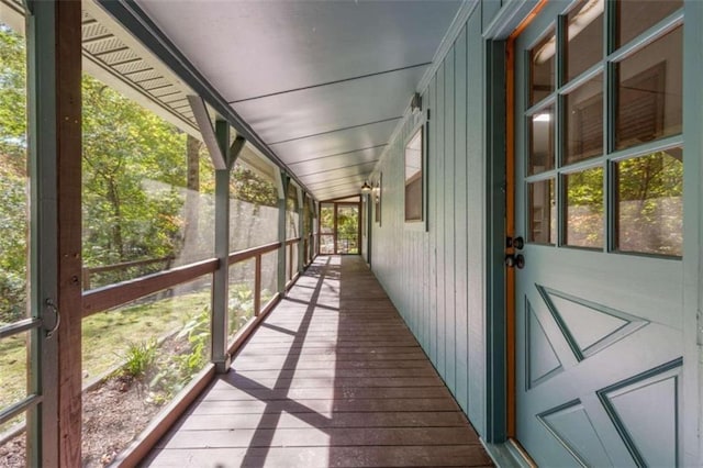 unfurnished sunroom with plenty of natural light