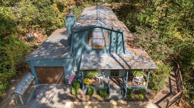 view of front of property with covered porch and a garage