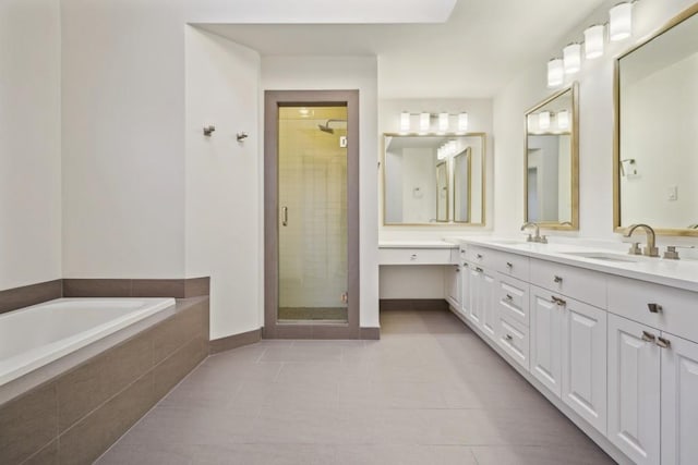 bathroom with tile patterned floors, vanity, and shower with separate bathtub