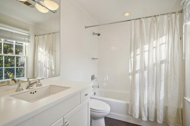 full bathroom featuring tile patterned flooring, vanity, shower / tub combo with curtain, and toilet