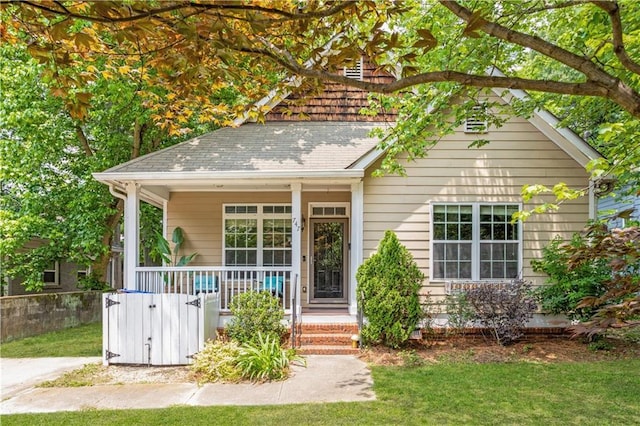 747 Dill Ave SW, Atlanta, GA 30310 - view of front of property with a porch, a front yard, and a shingled roof