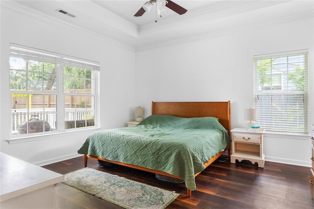 747 Dill Ave SW, Atlanta, GA 30310 - bedroom with crown molding, wood finished floors, a tray ceiling, ceiling fan, and baseboards
