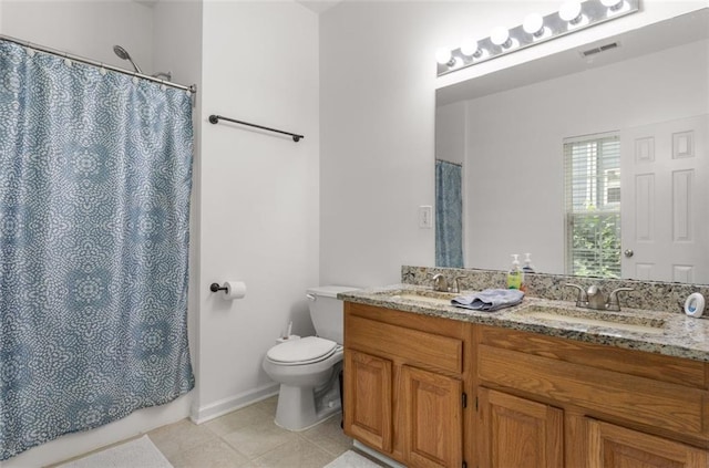 747 Dill Ave SW, Atlanta, GA 30310 - full bath featuring double vanity, tile patterned floors, toilet, and a shower with curtain