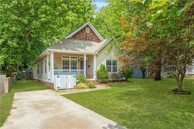 747 Dill Ave SW, Atlanta, GA 30310 - view of front of home featuring a porch and roof with shingles
