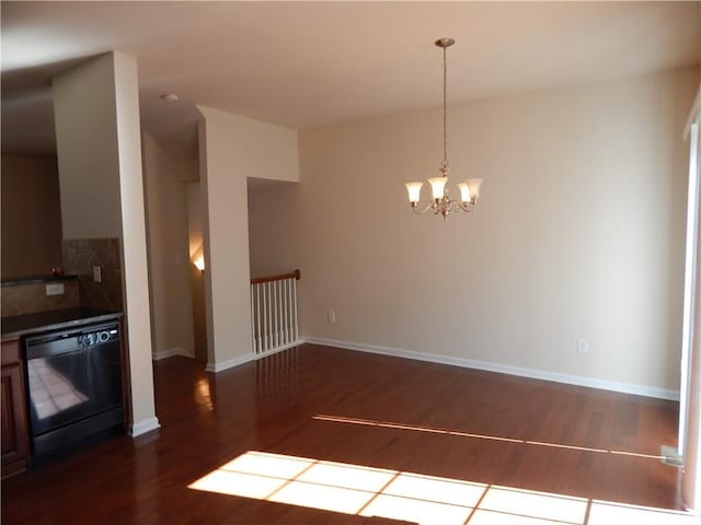 2199 Landing Walk Dr, Duluth, GA 30097 - unfurnished dining area with dark wood finished floors and a chandelier