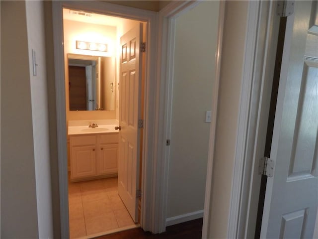 2199 Landing Walk Dr, Duluth, GA 30097 - hall featuring a sink and light tile patterned floors