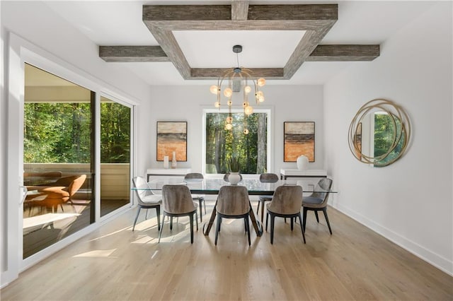 dining space with light hardwood / wood-style flooring, beamed ceiling, and a notable chandelier