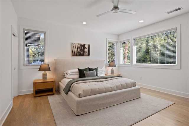 bedroom featuring ceiling fan and light hardwood / wood-style floors