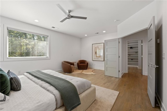 bedroom featuring wood-type flooring and ceiling fan