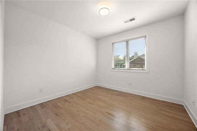 unfurnished room featuring light hardwood / wood-style flooring