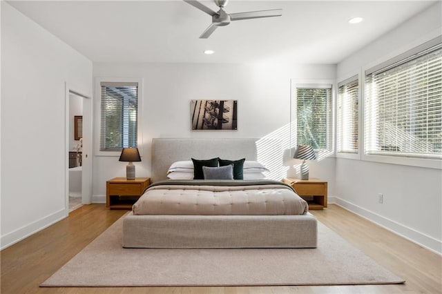 bedroom featuring ceiling fan and light hardwood / wood-style flooring