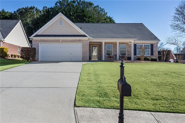 view of front of property featuring a garage and a front yard