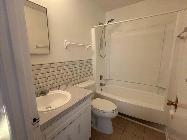 full bathroom with vanity, shower / washtub combination, tile patterned floors, toilet, and decorative backsplash