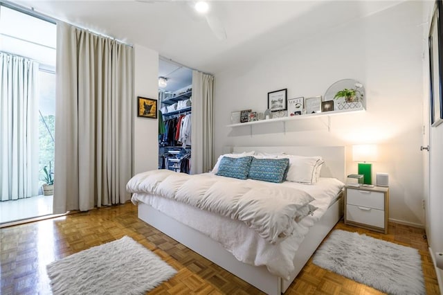 130 26th St NW Unit 701, Atlanta, GA 30309 - bedroom featuring a closet, a walk in closet, and baseboards