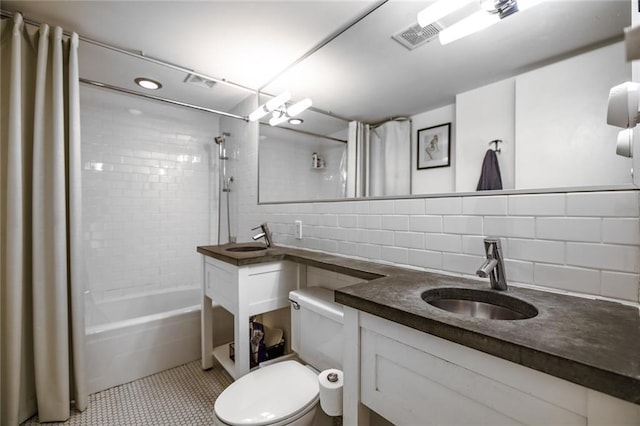 130 26th St NW Unit 701, Atlanta, GA 30309 - bathroom with shower / tub combo, decorative backsplash, toilet, and vanity