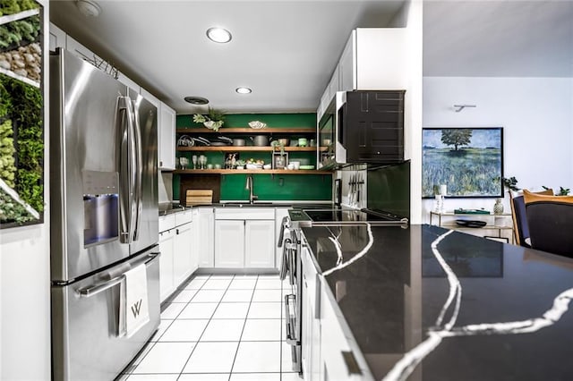 130 26th St NW Unit 701, Atlanta, GA 30309 - kitchen featuring stainless steel refrigerator with ice dispenser, open shelves, white cabinetry, light tile patterned floors, and a sink