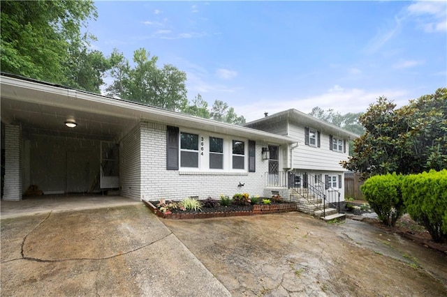 3664 Pin Oak Cir, Atlanta, GA 30340 - view of front of property featuring driveway, brick siding, and a carport