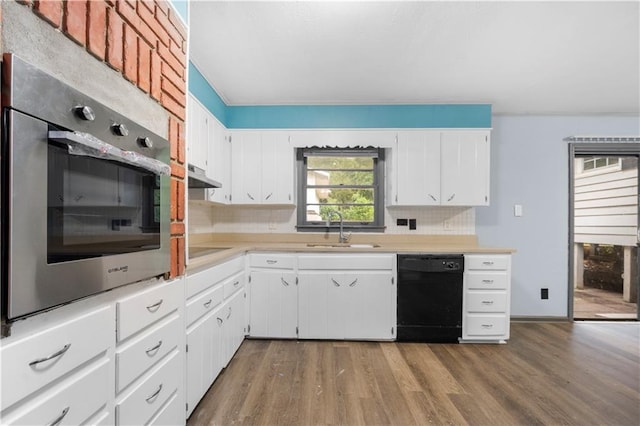 3664 Pin Oak Cir, Atlanta, GA 30340 - kitchen with black appliances, a sink, light countertops, and wood finished floors