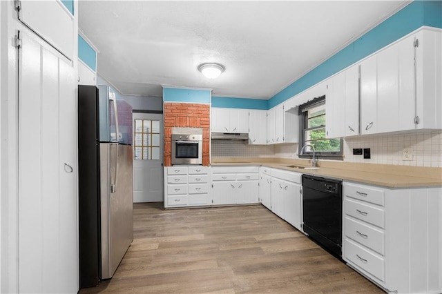 3664 Pin Oak Cir, Atlanta, GA 30340 - kitchen with stainless steel appliances, decorative backsplash, under cabinet range hood, and light countertops