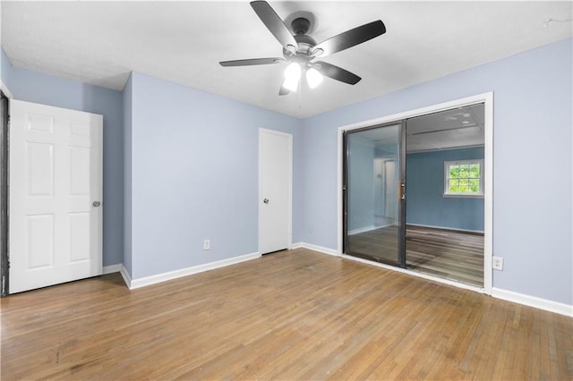 3664 Pin Oak Cir, Atlanta, GA 30340 - unfurnished bedroom with baseboards, light wood-type flooring, a ceiling fan, and a closet