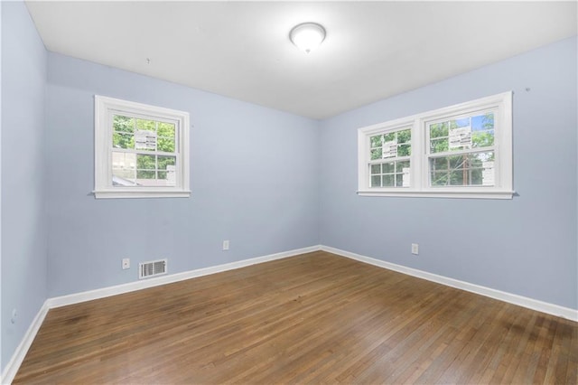 3664 Pin Oak Cir, Atlanta, GA 30340 - spare room with baseboards and wood-type flooring