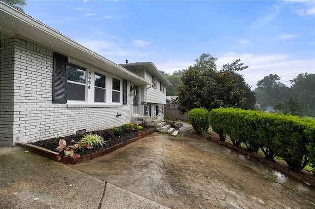 3664 Pin Oak Cir, Atlanta, GA 30340 - view of property exterior with brick siding and crawl space