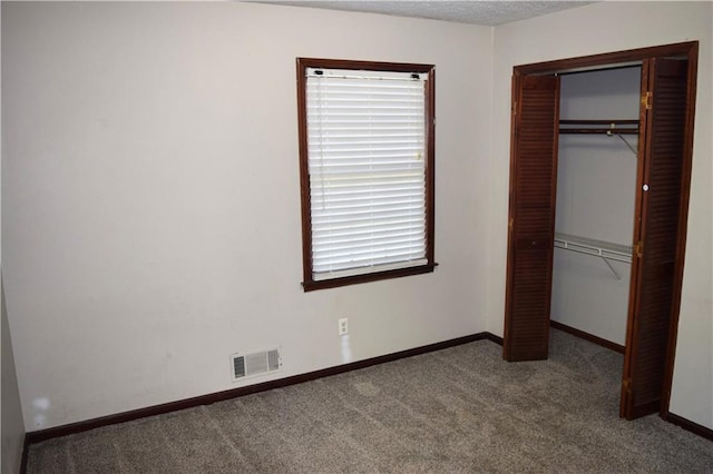 157 Sequoyah Cir, Canton, GA 30115 - unfurnished bedroom featuring carpet flooring, a closet, and baseboards