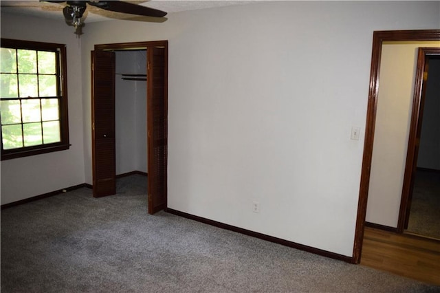 157 Sequoyah Cir, Canton, GA 30115 - unfurnished bedroom with carpet floors, baseboards, a closet, and a ceiling fan