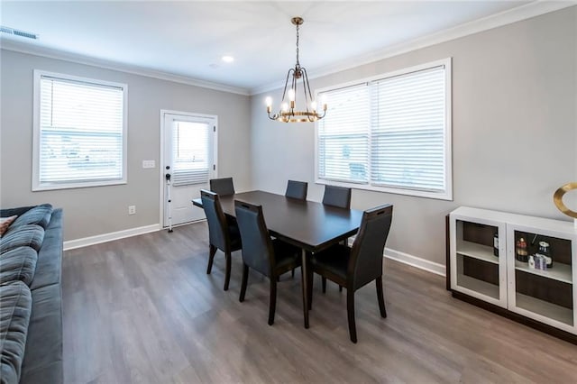 3739 Silvery Way, Powder Springs, GA 30127 - dining area featuring visible vents, baseboards, a chandelier, and crown molding