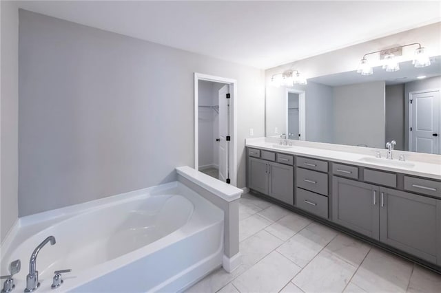3739 Silvery Way, Powder Springs, GA 30127 - full bathroom featuring double vanity, a bath, marble finish floor, and a sink