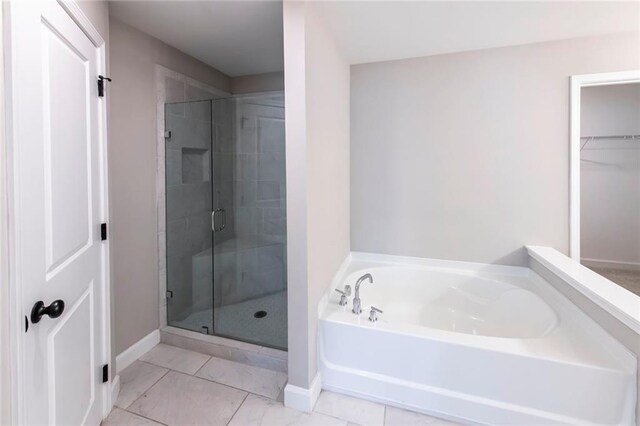 3739 Silvery Way, Powder Springs, GA 30127 - full bath with baseboards, a bath, and a shower stall