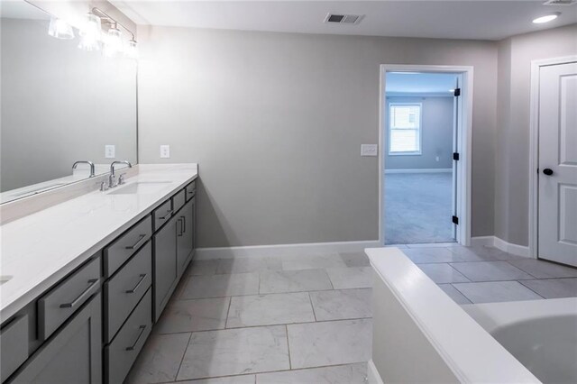 3739 Silvery Way, Powder Springs, GA 30127 - full bathroom featuring visible vents, marble finish floor, baseboards, a bath, and vanity