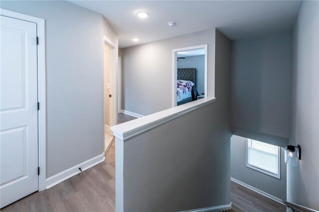 3739 Silvery Way, Powder Springs, GA 30127 - hall with recessed lighting, baseboards, an upstairs landing, and wood finished floors