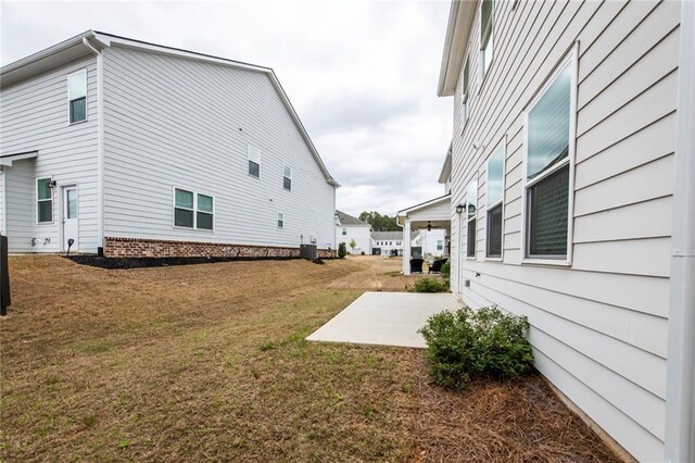 3739 Silvery Way, Powder Springs, GA 30127 - view of yard with central air condition unit and a patio area