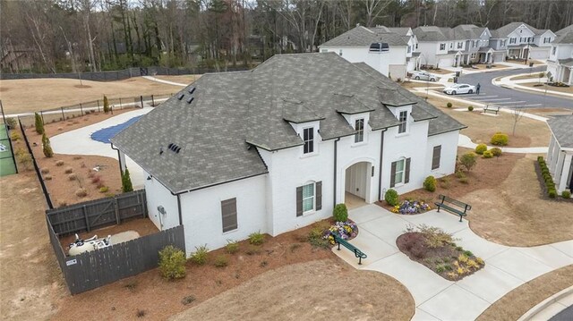 3739 Silvery Way, Powder Springs, GA 30127 - view of front of house with a residential view, stucco siding, a shingled roof, and a fenced backyard