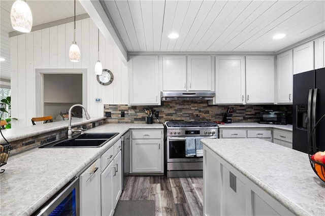 kitchen with wooden ceiling, under cabinet range hood, light countertops, black appliances, and a sink