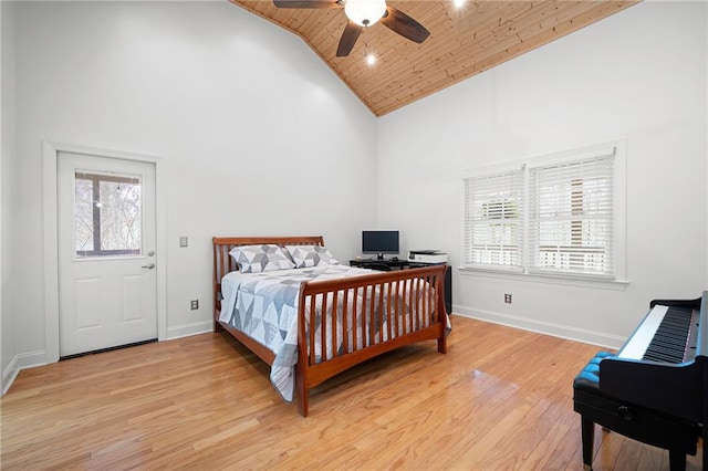 bedroom featuring wood ceiling, ceiling fan, high vaulted ceiling, light wood-type flooring, and baseboards