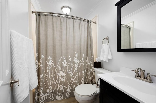 bathroom featuring a shower with curtain, crown molding, vanity, and toilet