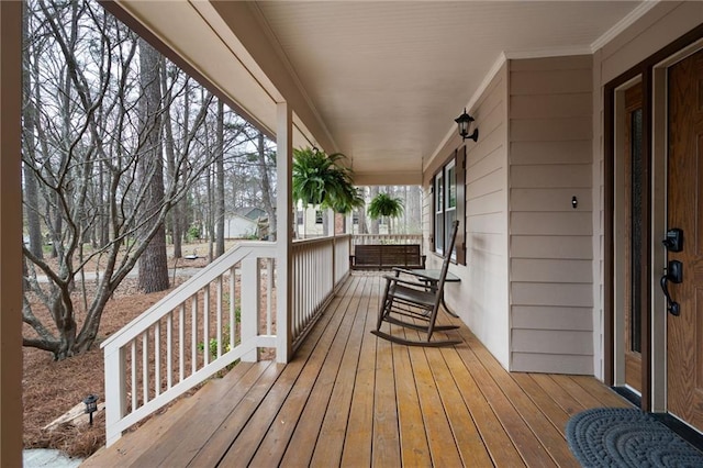 wooden terrace with a porch