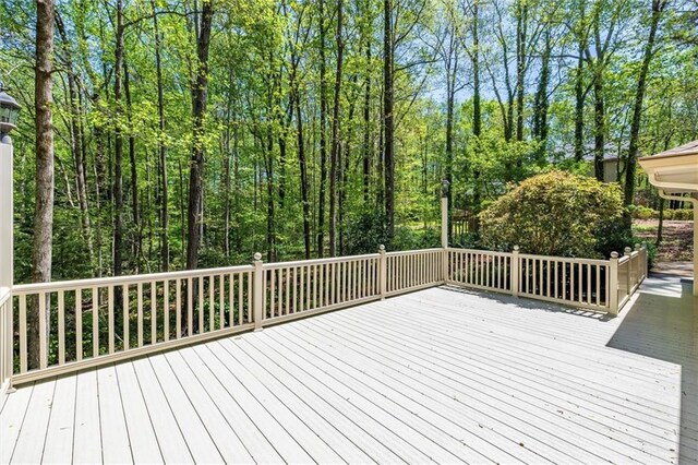 6141 Windsong Way, Smoke Rise, GA 30087 - half bathroom with toilet, vanity, crown molding, and tile patterned floors