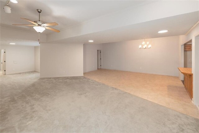 6141 Windsong Way, Smoke Rise, GA 30087 - empty room with a chandelier, a ceiling fan, baseboards, light carpet, and recessed lighting
