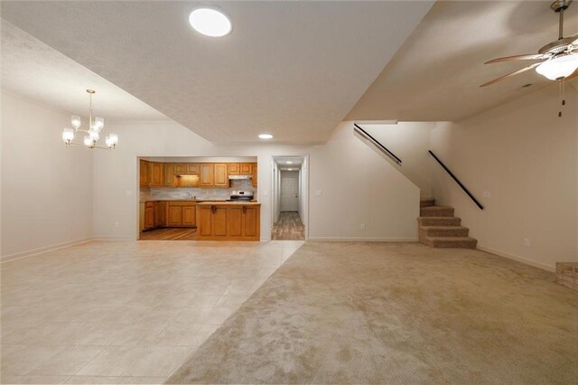 6141 Windsong Way, Smoke Rise, GA 30087 - unfurnished living room with ceiling fan, baseboards, a chandelier, stairs, and light tile patterned floors
