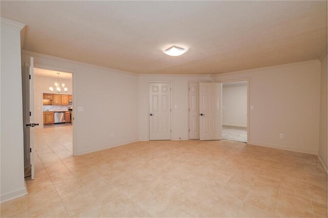 6141 Windsong Way, Smoke Rise, GA 30087 - spare room with a chandelier, crown molding, and baseboards